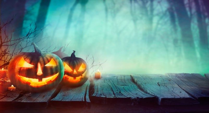 Jack-o-lanterns on wooden deck