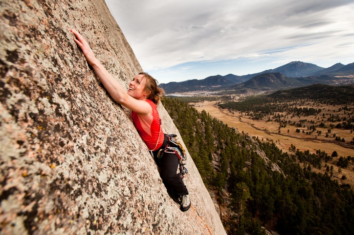 image of girl rock climbing
