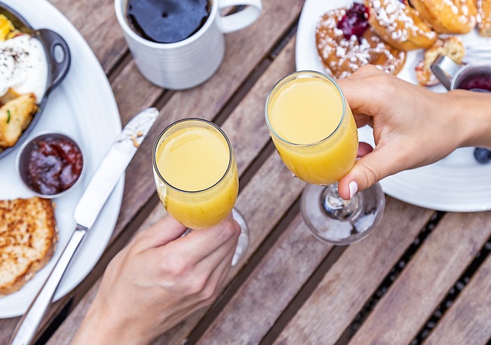 A toast with mimosas