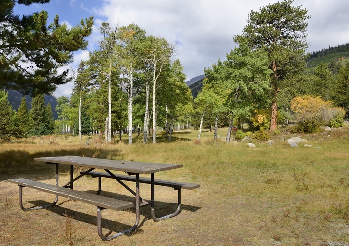 A beautiful day with picnic table at the end of summer in the Rocky Mountain National Park in Colorado.